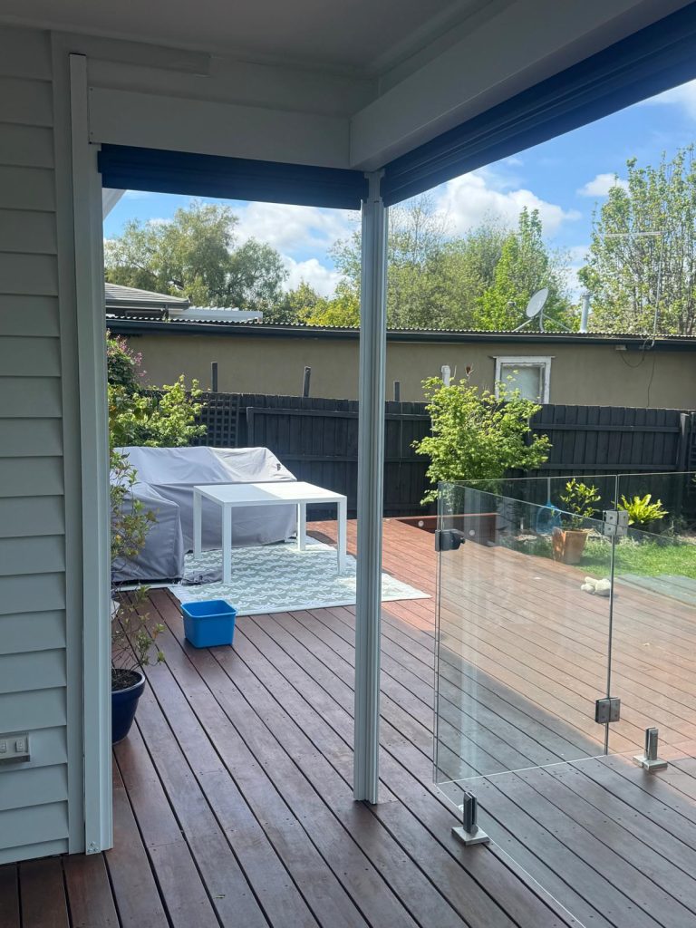 This project in Cheltenham required a tailored approach to navigate a tricky corner on a pergola. We utilised a custom removable post on the corner to allow a clear walk-way when the blinds are retracted and post is removed. The client chose a 99% blockout mesh for wind, rain and sun protection without sacrificing their view. The job also required custom Colorbond flashings to infill the gap above the pelmets due to the pitch of the roof.